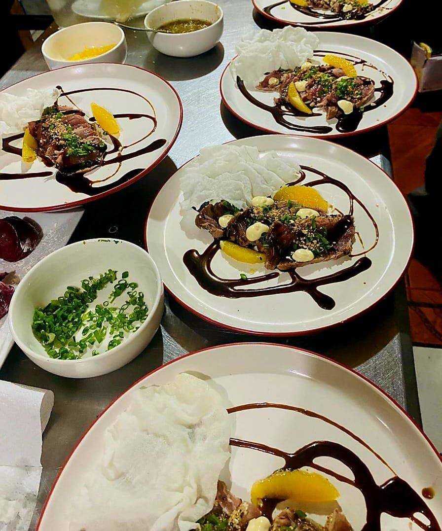 Table with several dishes of food, including rice